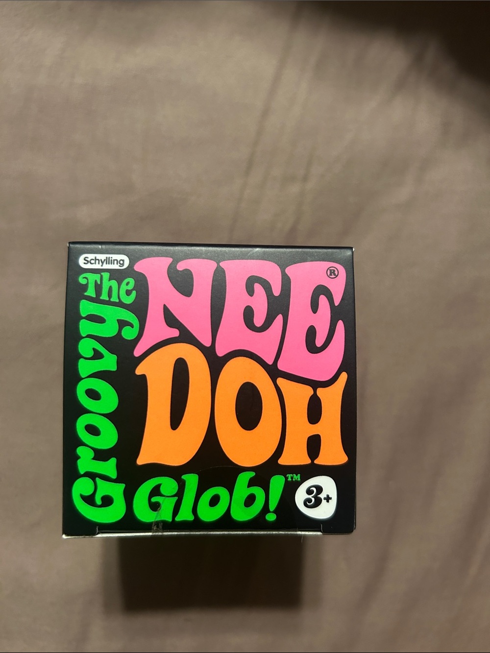 New Groovy Nee Doh Glob! Sensory Squeeze Toy - Black with Pink, Orange & Green